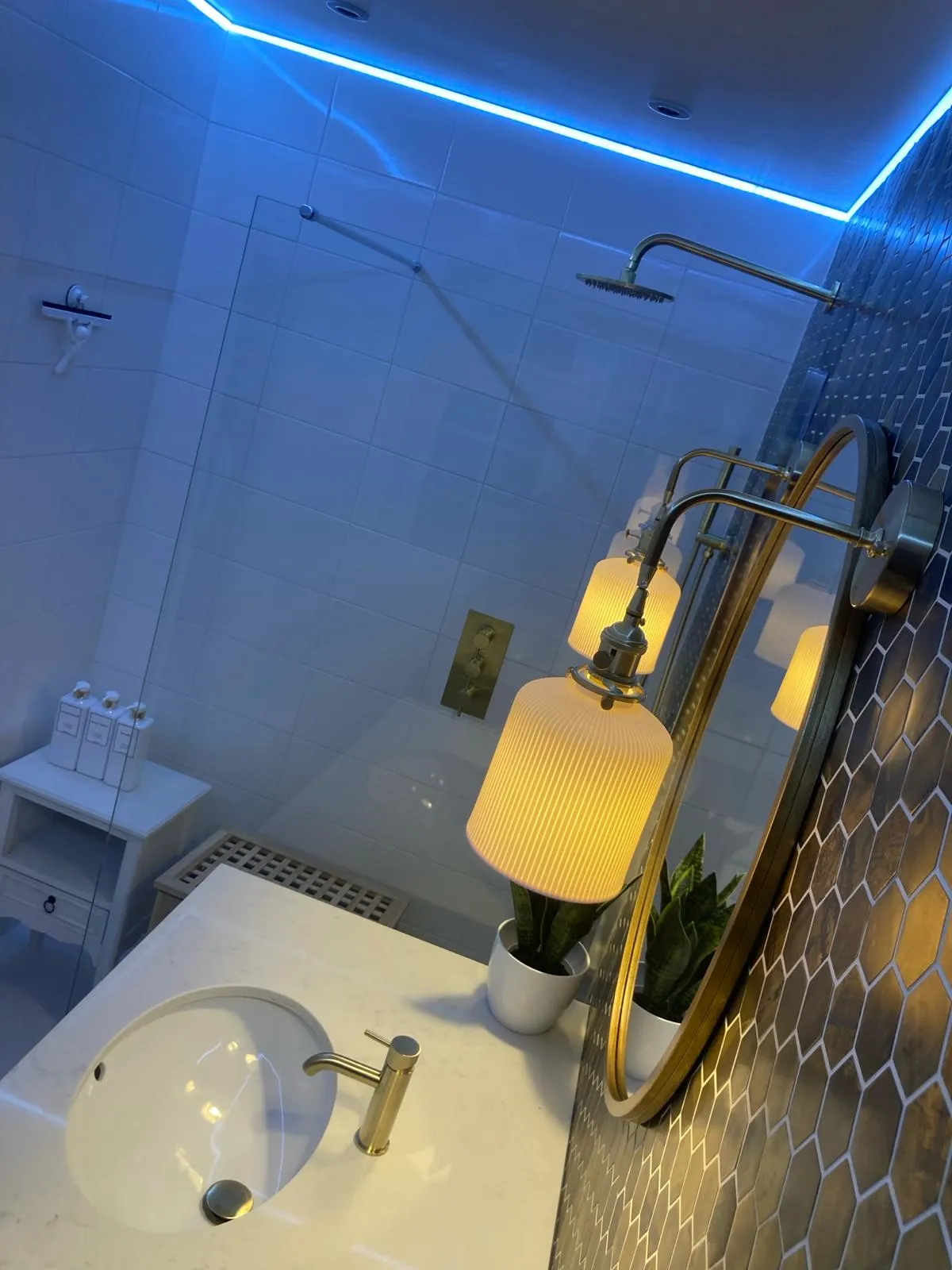 Bathroom with a mirror and a sink.